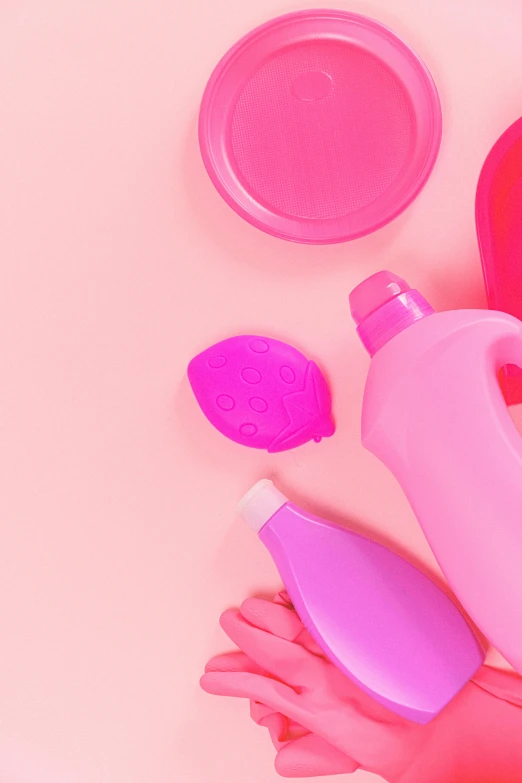 a close up of a person's hand holding a bottle of liquid, trending on pexels, plasticien, streamlined pink armor, toys, wash, hearts