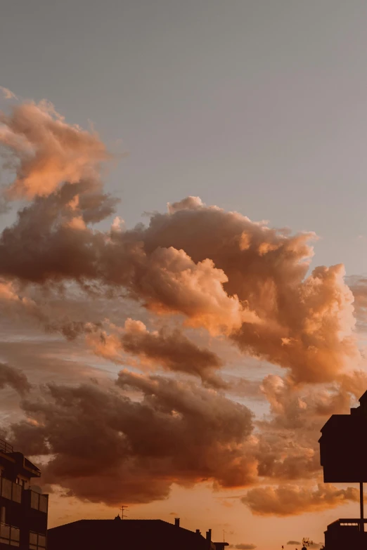 a large clock tower sitting in the middle of a city, a picture, pexels contest winner, romanticism, cotton candy clouds, sunset in a valley, layered stratocumulus clouds, girl clouds