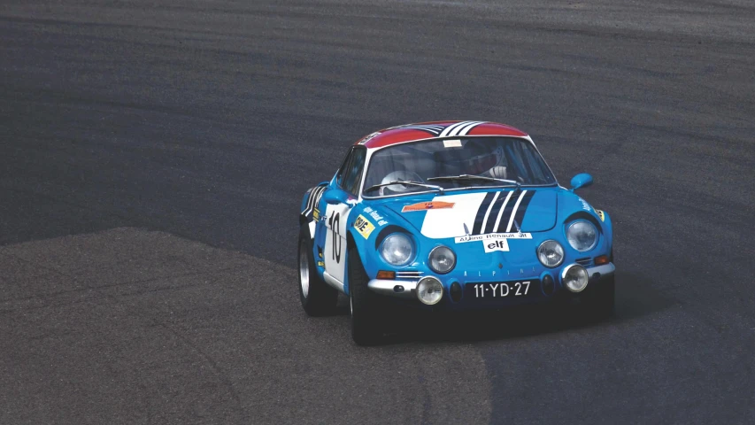 a blue and white car driving on a race track, by Pierre Laffillé, retro colour, renault, getty images, 🚿🗝📝