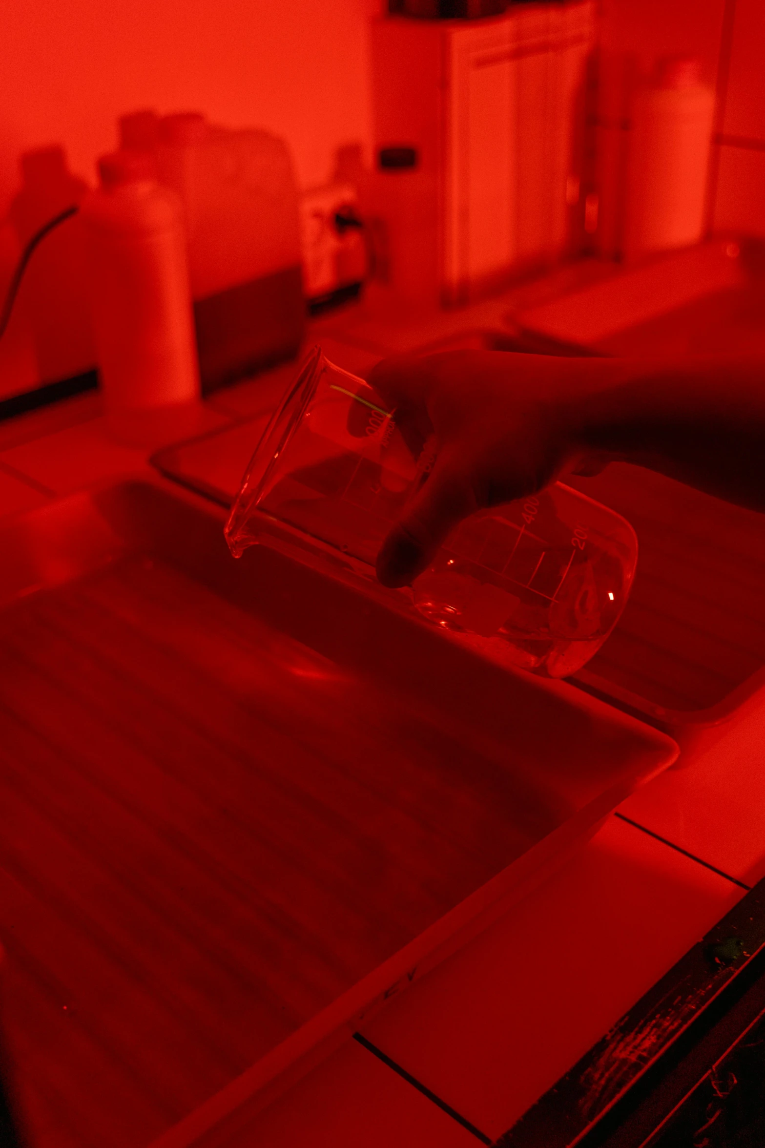 a close up of a kitchen sink under a red light, a silk screen, in a lab, light emitting from fingertips, coral red, slide show