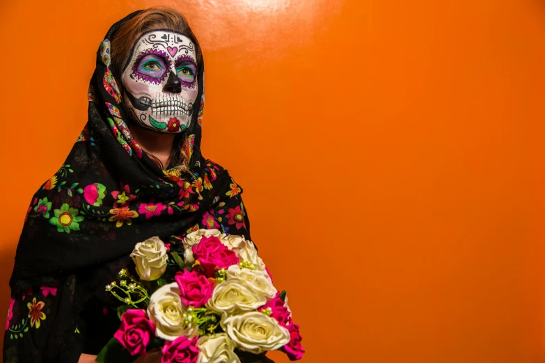 a woman in day of the dead makeup holding a bouquet of flowers, by Meredith Dillman, pexels contest winner, hyperrealism, slide show, face is wrapped in a black scarf, orange skin. intricate, mexico