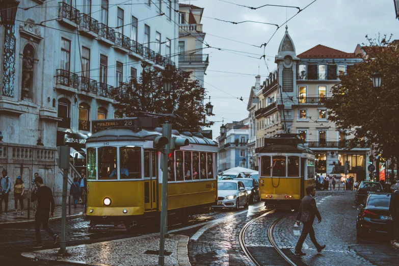 a couple of trolleys that are on a street, by Matija Jama, pexels contest winner, square, surrounding the city, 🚿🗝📝