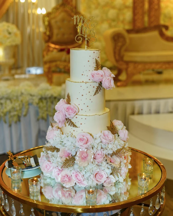 a wedding cake sitting on top of a table, ameera al taweel, thumbnail, fully decorated, multiple stories