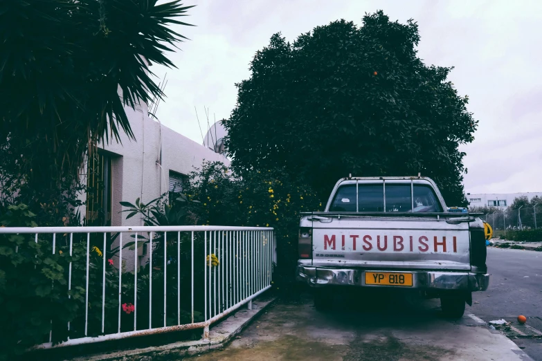 a truck parked in front of a white fence, inspired by Miyagawa Chōshun, unsplash, kitsch movement, earthbound, bathhouse, 🚿🗝📝, classic vibes