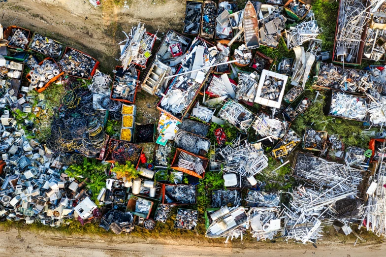 a large pile of junk sitting on the side of a road, by Daniel Lieske, unsplash, auto-destructive art, aerial shot from the drone, scrap metal on workbenches, 15081959 21121991 01012000 4k, color aerial photo drone