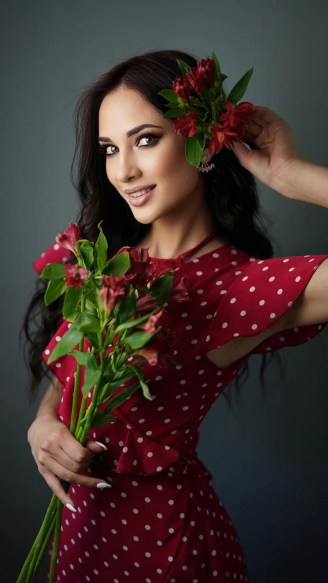 a woman in a red dress holding a bunch of flowers, by Natasha Tan, shutterstock, beautiful arab woman, digital photo, polka dot, 2995599206