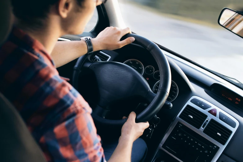 a man driving a car with his hands on the steering wheel, pexels, renaissance, square, australian, profile image, standing sideways