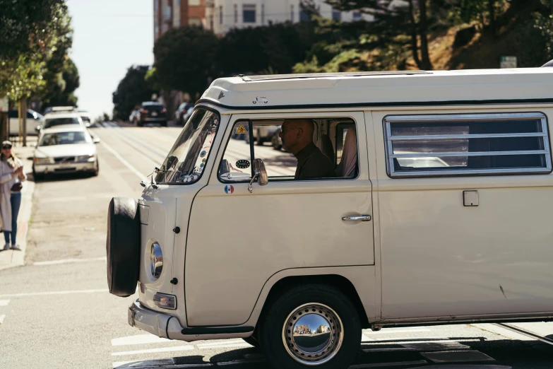 a white van parked on the side of a road, unsplash, renaissance, san francisco, bill murray, kombi, sunny bay window