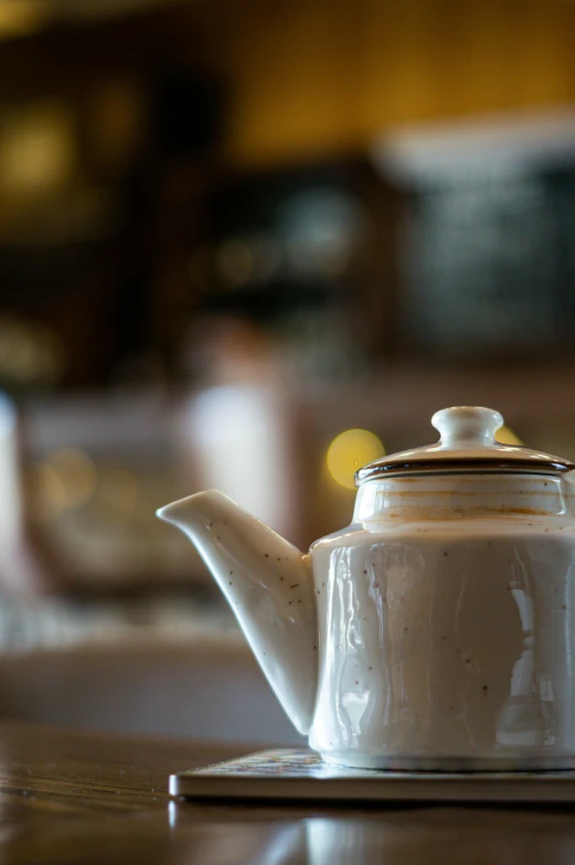 a white tea pot sitting on top of a wooden table, daily specials, thumbnail, fine dining, cozy setting