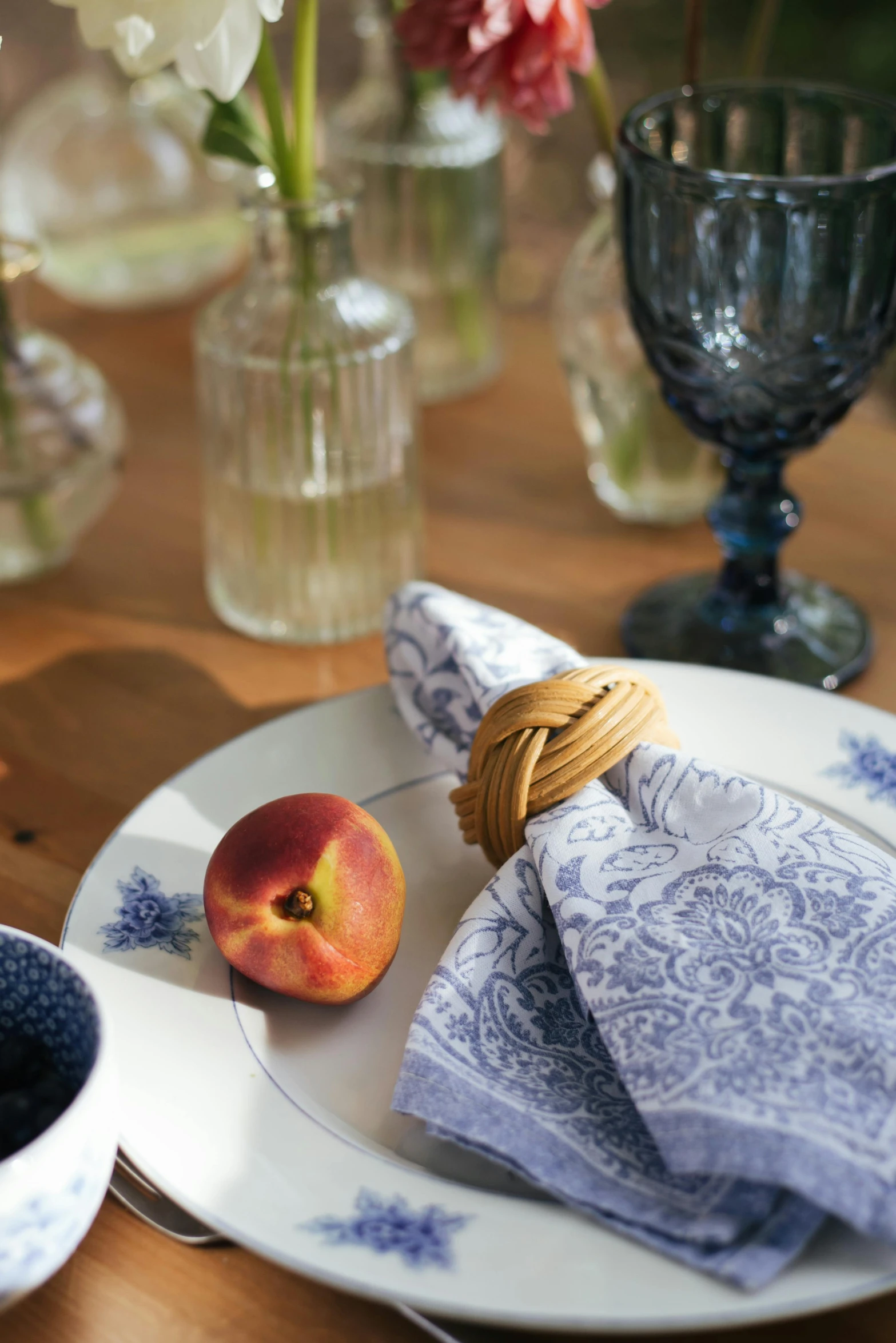 a close up of a plate of food on a table, inspired by Richmond Barthé, renaissance, navy, cloth accessories, rustic, peach