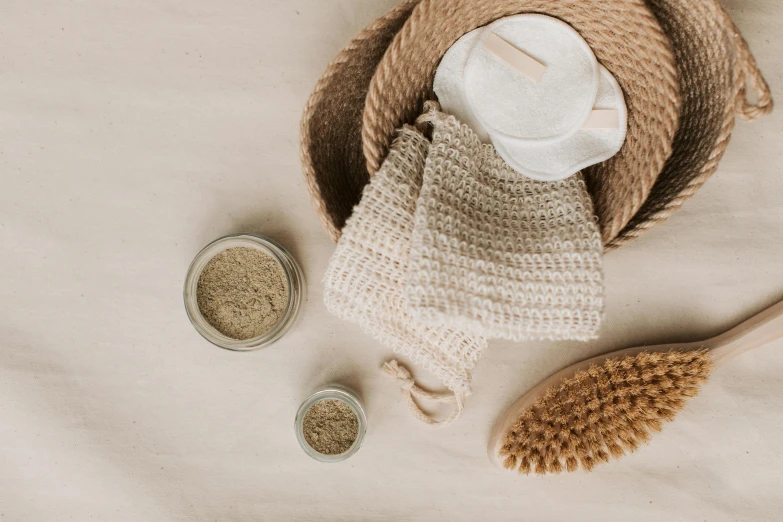 a couple of wooden spoons sitting on top of a table, skincare, burlap, taupe, collection product