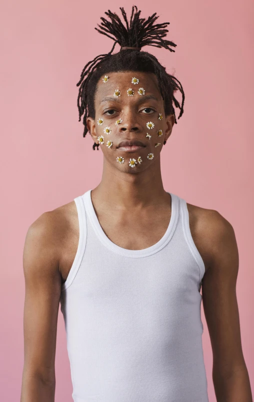 a young man with gold confetti on his face, by Ellen Gallagher, black teenage boy, symmetrical face and body, nonbinary model, head made of giant daisies