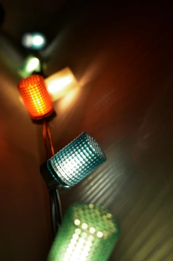 a couple of lights that are on a wall, by David Donaldson, flickr, coloured, up close shot, in a row, decorations