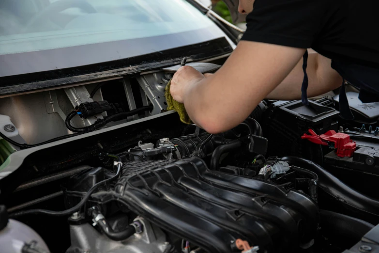 a man is working on a car's engine, profile image, detailing, technical, superdetail