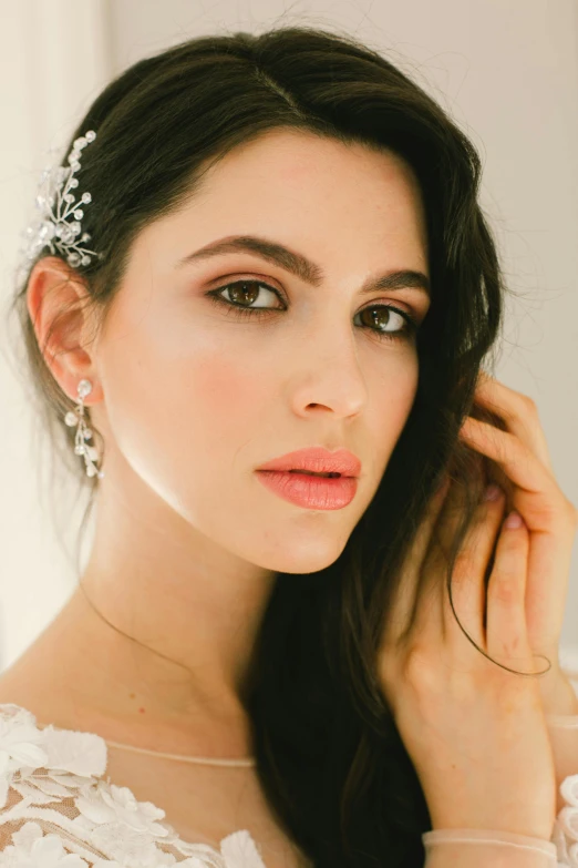 a woman in a wedding dress posing for a picture, a digital rendering, inspired by Anita Malfatti, trending on pexels, coral lipstick, close up face detail, long earrings, beauty campaign