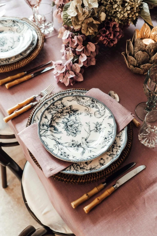 a table that has a bunch of plates on it, instagram, rococo, romantic lead, at a dinner table, low details, detailed product shot