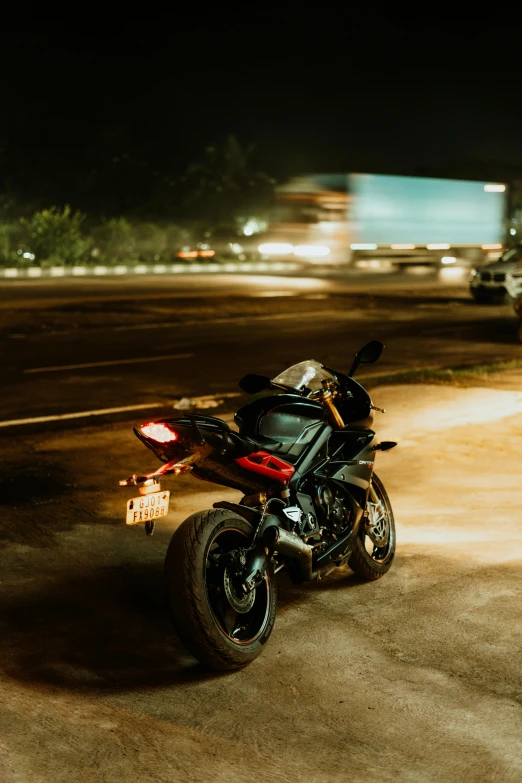 a motorcycle is parked on the side of the road, pexels contest winner, night time low light, hindu, r6, mixed art