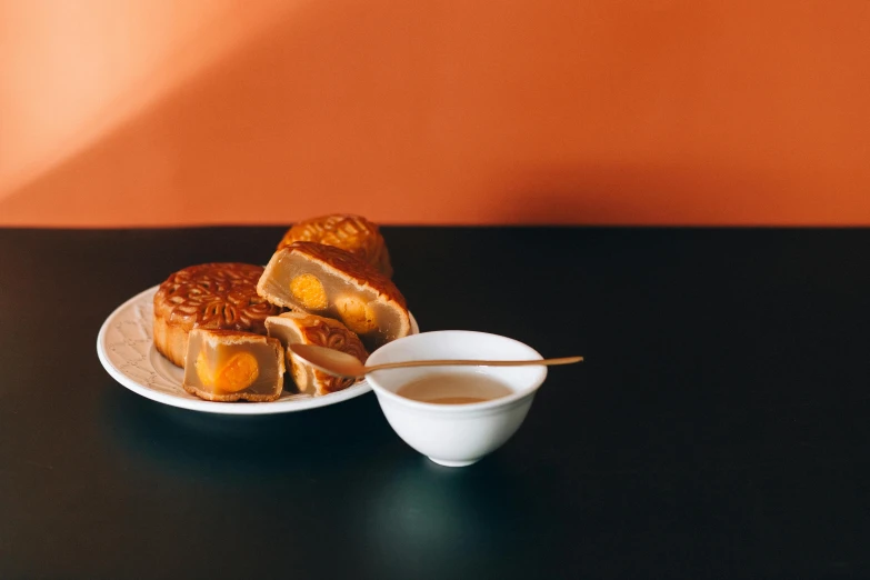 a close up of a plate of food on a table, a still life, inspired by Mi Fu, trending on unsplash, hurufiyya, caramel, bao pnan, square, thumbnail