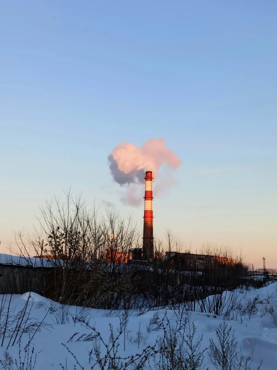 a factory with a lot of smoke coming out of it, pexels contest winner, snowy arctic environment, chimney with smoke, low quality photo, profile image