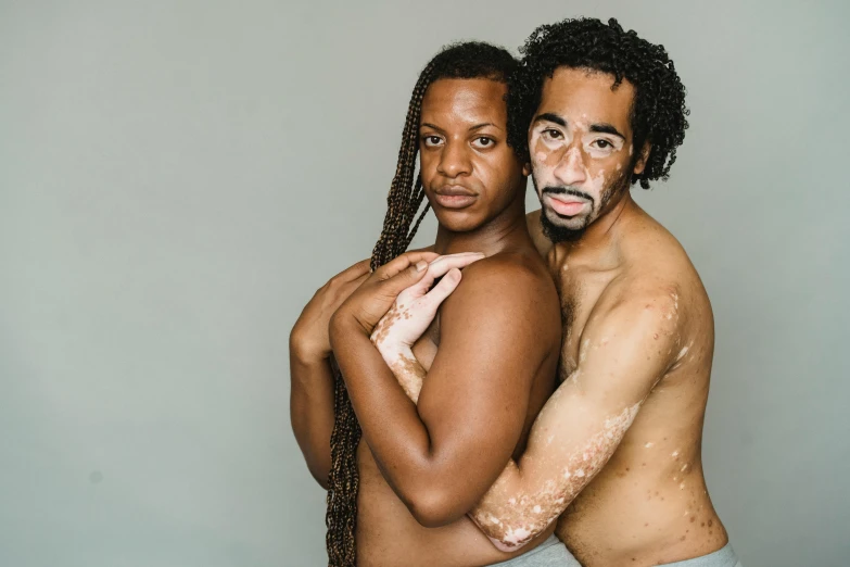 a man and a woman standing next to each other, by Ellen Gallagher, unsplash, renaissance, brown skin like soil, body hair, covered in white flour, nonbinary model