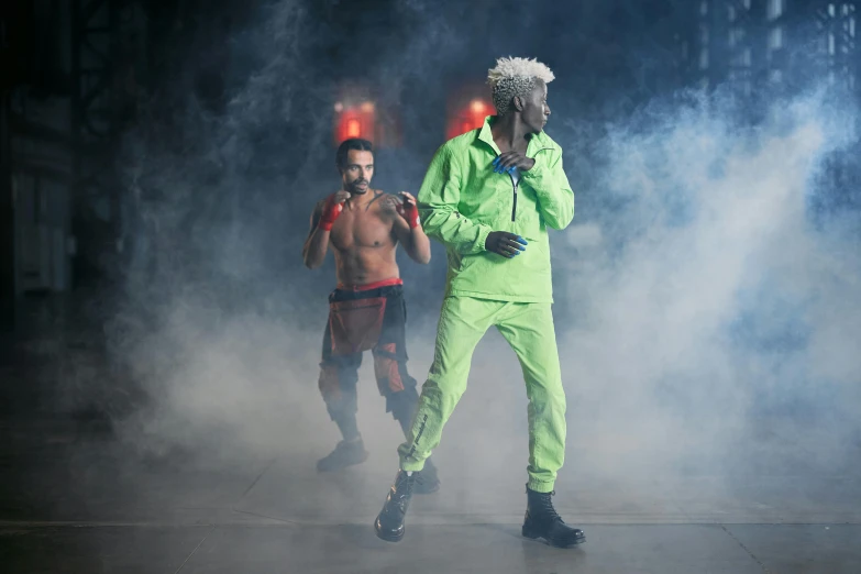 a couple of men standing next to each other on a stage, pexels, antipodeans, die antwoord style wear, green neon details, lil uzi vert, behind the scenes photo