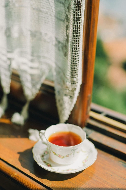 a cup of tea sitting on a window sill, renaissance, fan favorite, al fresco, up close, vanilla