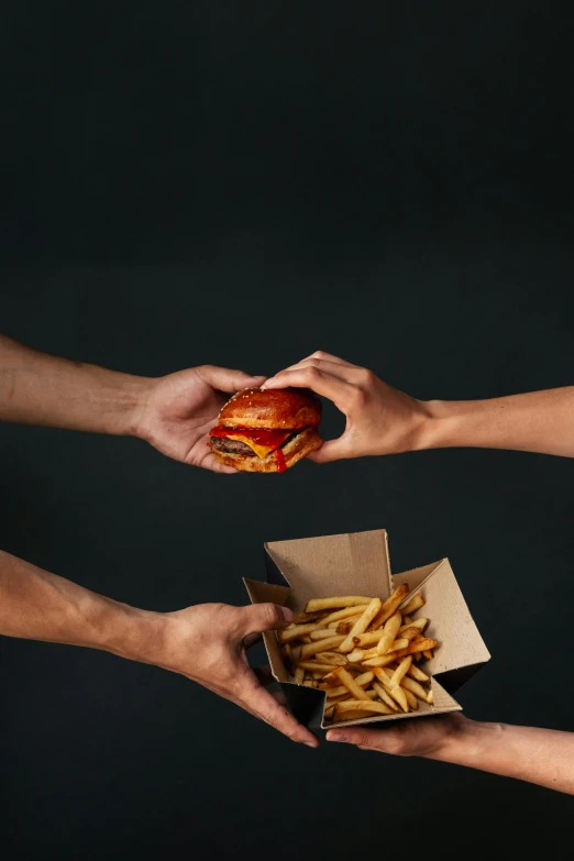 a group of people holding a hamburger and french fries, an album cover, unsplash, dark. no text, reaching out to each other, sleek hands, 15081959 21121991 01012000 4k