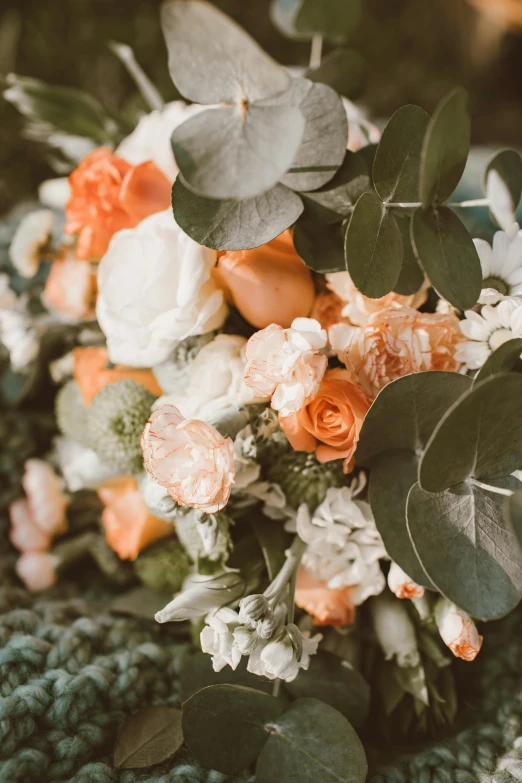 a bouquet of flowers sitting on top of a table, by Robbie Trevino, trending on unsplash, romanticism, orange grey white, eucalyptus, detail shot, graphic detail