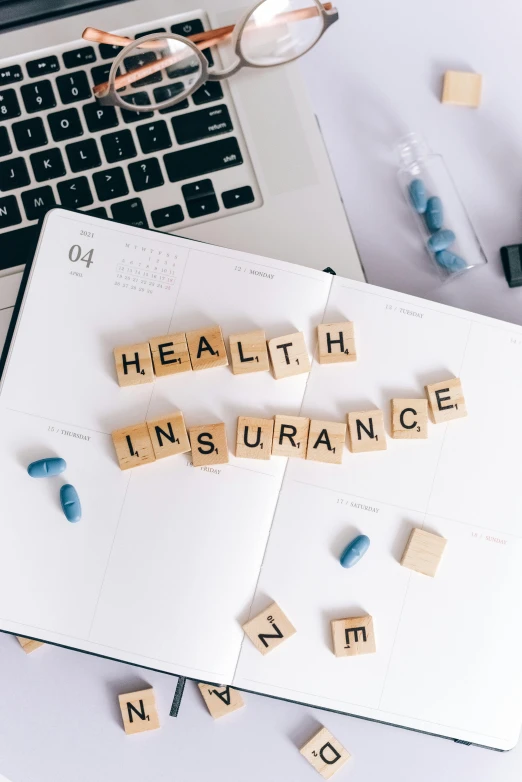 the word health insurance spelled in scrabbles next to a laptop, a cartoon, unsplash, renaissance, thumbnail, iso, premium, teaser