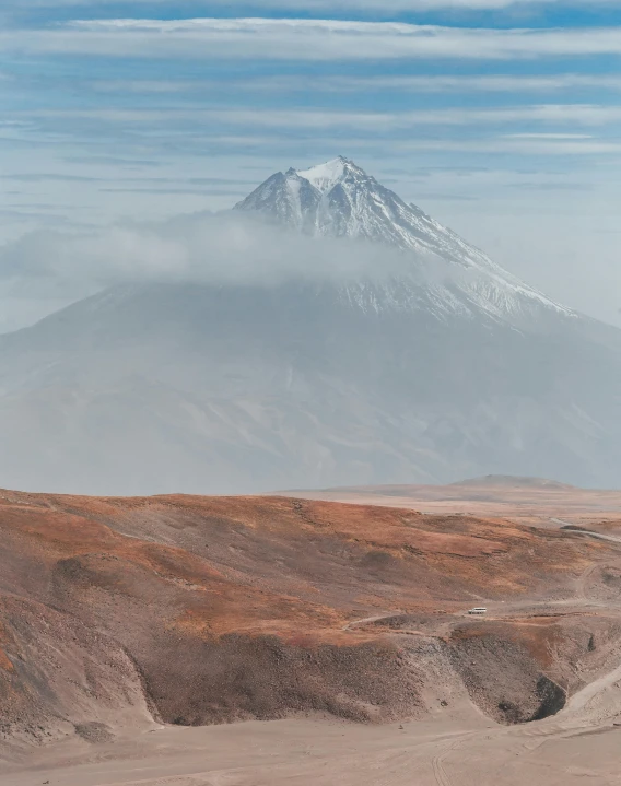 a person riding a horse with a mountain in the background, a matte painting, unsplash contest winner, surrealism, infographic of active volcanoes, chile, dust clouds | homoerotic, photo of putin