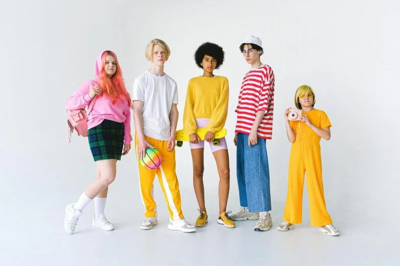 a group of people standing next to each other, inspired by Wes Anderson, maximalism, die antwoord yolandi visser, casual streetwear, pink and yellow, teenage boy