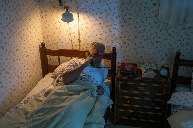 a person laying in a bed next to a night stand, by Elsa Bleda, pexels contest winner, hyperrealism, an oldman, phone photo, nursing home, 2 5 6 x 2 5 6 pixels