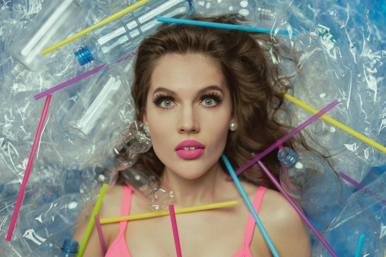 a woman with an umbrella made out of plastic bottles, an album cover, inspired by David LaChapelle, pexels contest winner, plasticien, portrait of barbara palvin, with a straw, aurora aksnes, pink lips