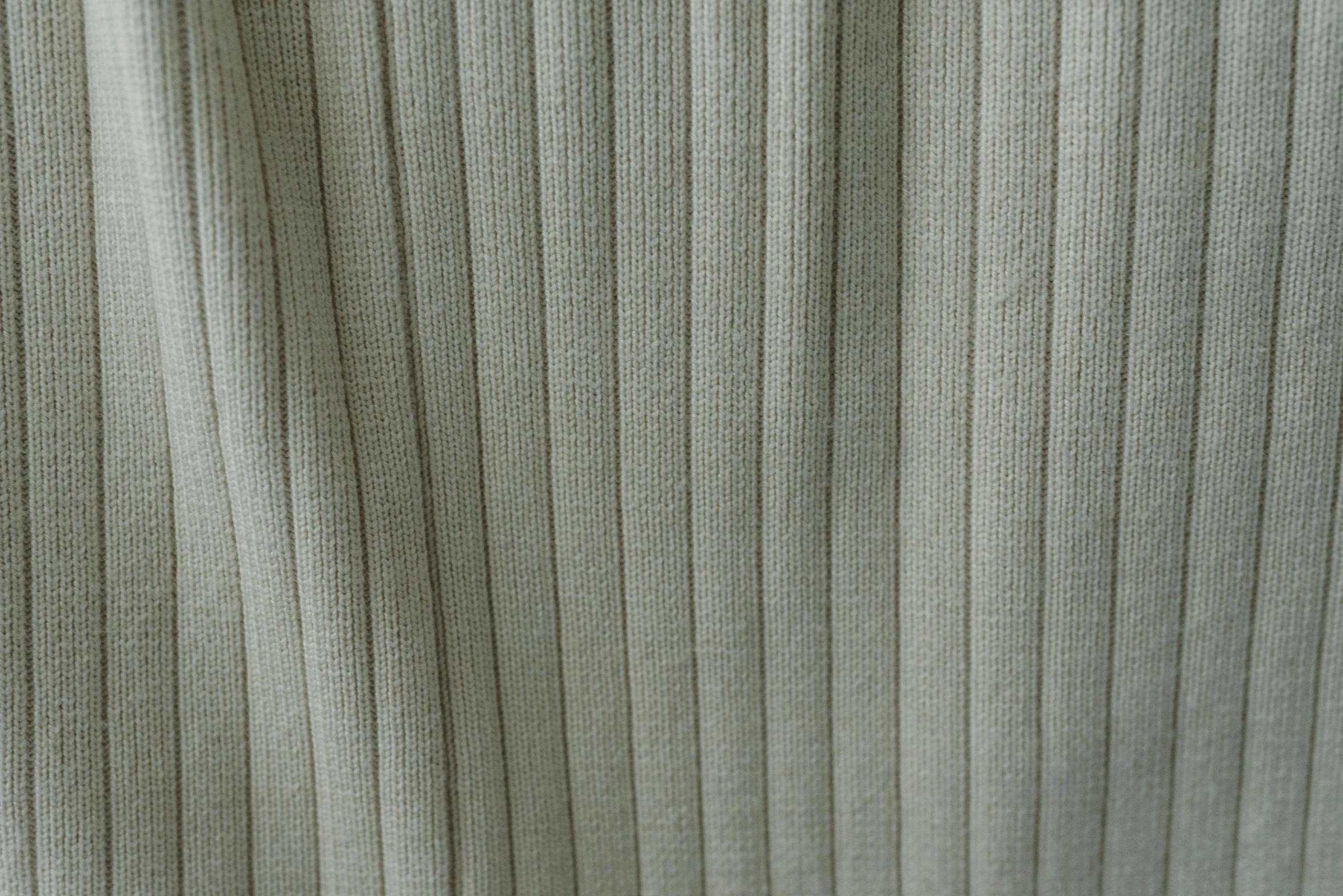 a close up of a curtain in a room, a pair of ribbed, soft light - n 9, neutral background, soft green natural light