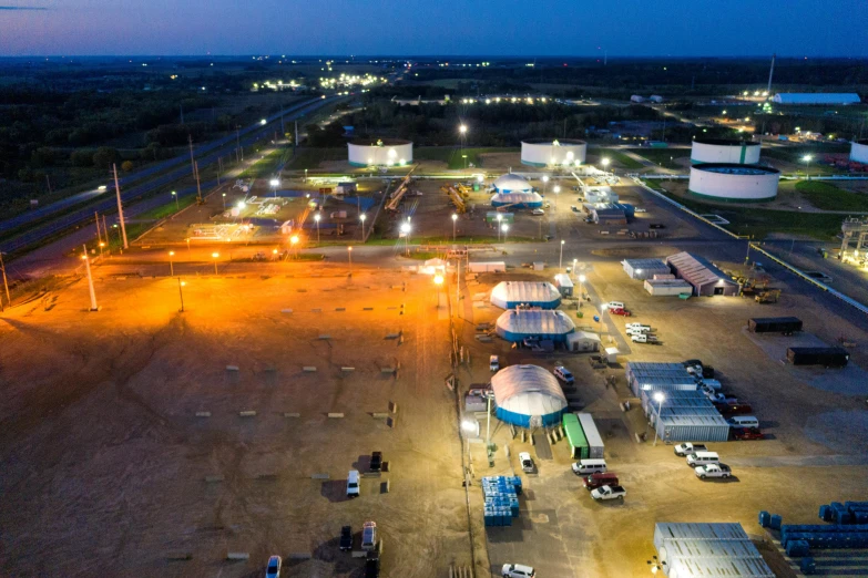 an aerial view of an oil field at night, a portrait, process art, propane tanks, worksafe. instagram photo, underground facility, listing image