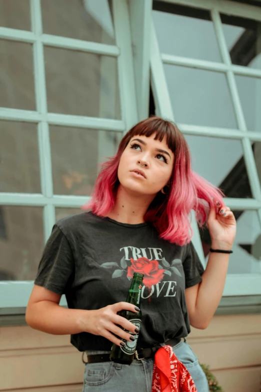 a woman with pink hair standing in front of a window, a photo, trending on pexels, wearing a black t-shirt, reds), rex orange county, hot topic