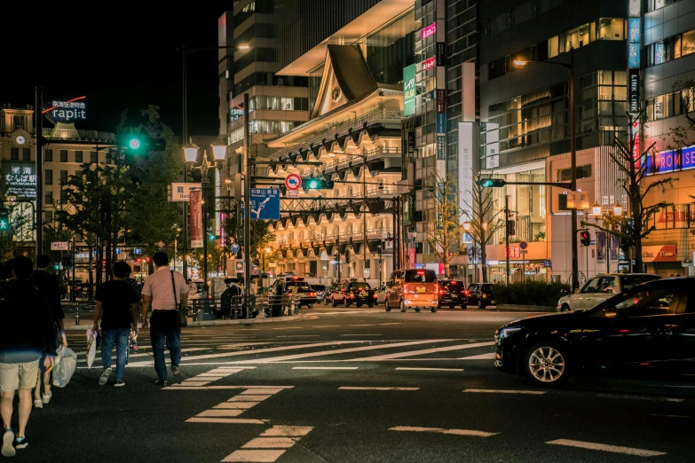 a group of people walking across a street at night, pexels contest winner, ukiyo-e, square, downtown, exterior photo, thumbnail