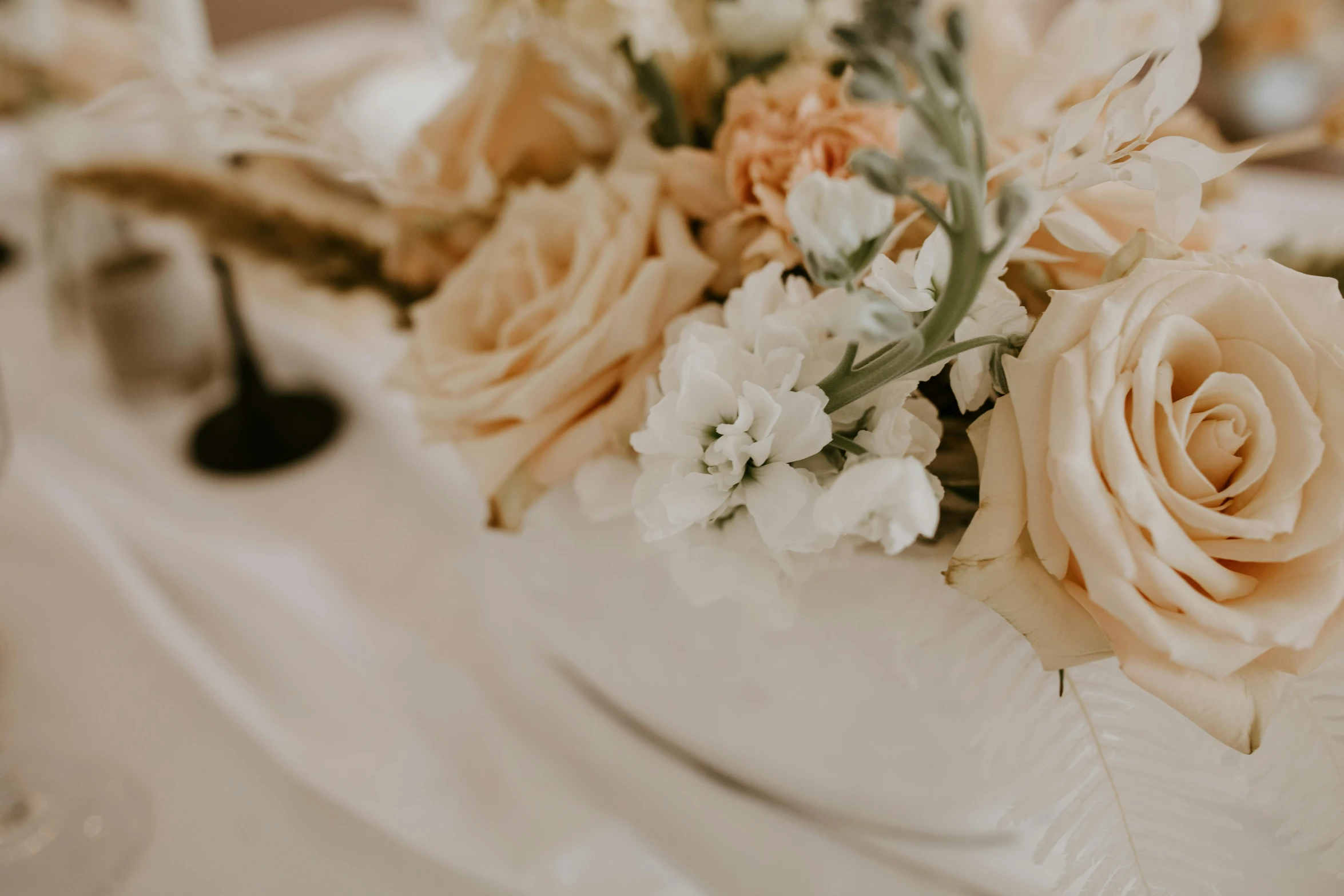 a close up of flowers in a vase on a table, by Carey Morris, trending on unsplash, cream and white color scheme, in shades of peach, celebration, background image