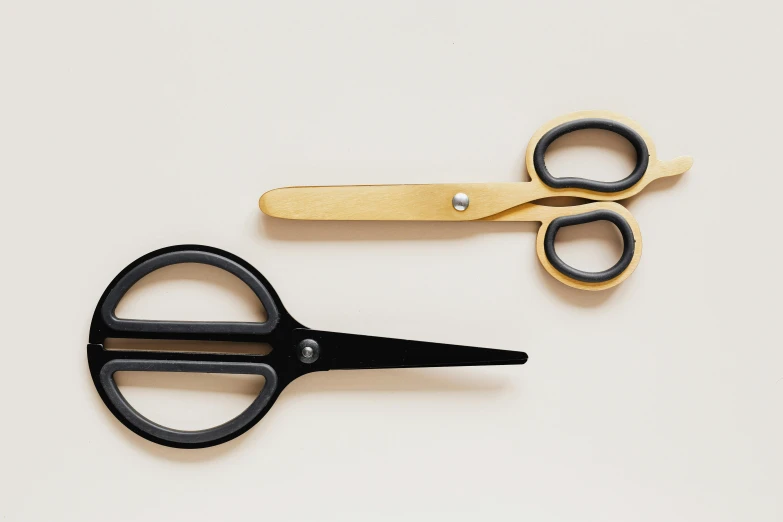 a pair of black and gold scissors next to each other, arabesque, dieter rams, handcrafted, two - tone, vanilla