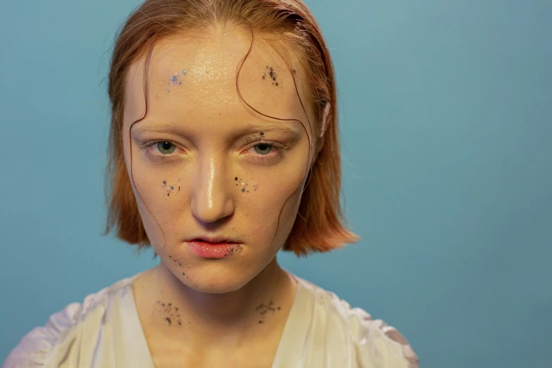 a close up of a woman with freckles on her face, an album cover, body modification, still from l'estate, portrait image, annoyed