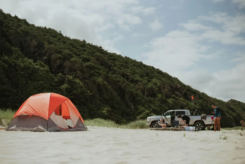 a couple of people standing next to a tent on a beach, te pae, off-roading, flat lay, profile image