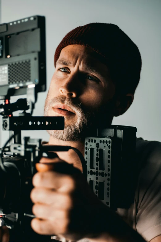 a close up of a person holding a camera, production quality cinema model, looking intensely at the camera, digitigrade, in an action pose