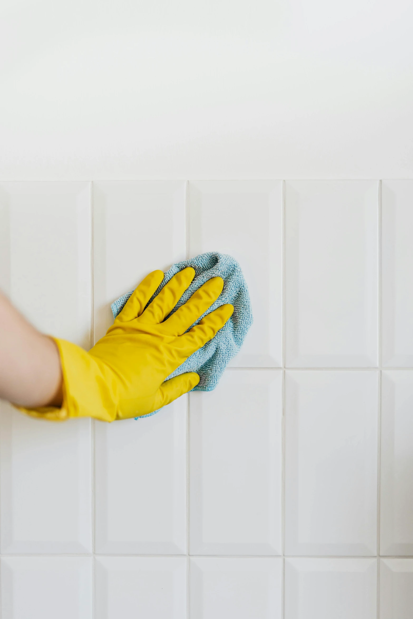 a person in yellow gloves cleaning a white tiled wall, shutterstock, art nouveau, square, pastel colorful mold, covid, no - text no - logo