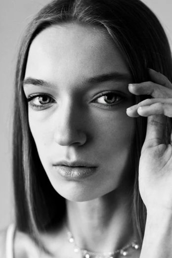 a black and white photo of a woman with long hair, pexels contest winner, hyperrealism, portrait sophie mudd, square facial structure, thin aged 2 5, andrey surnov
