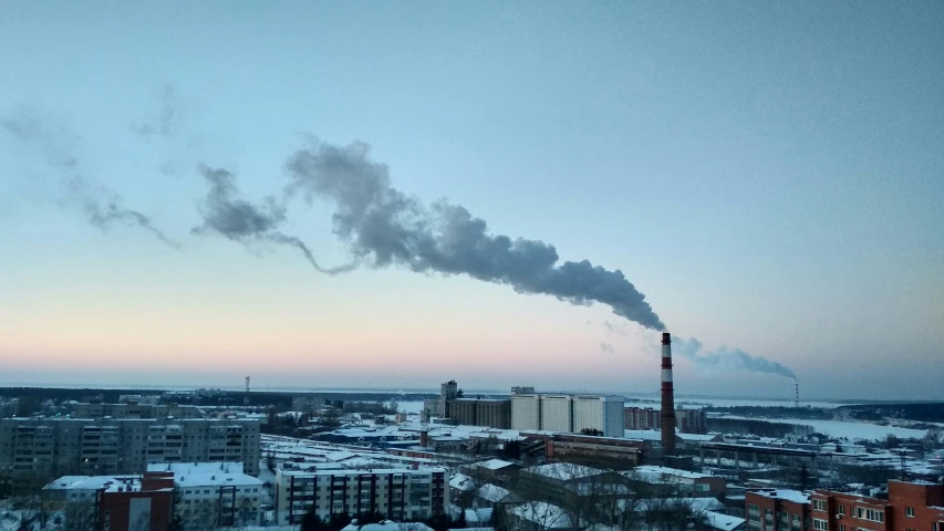 the smoke is coming out of the chimney of a factory, by Christen Dalsgaard, pexels contest winner, hurufiyya, freezing, skyline, miro petrov, low quality photo