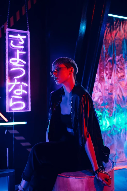a man sitting on a stool in front of a neon sign, trending on pexels, kiko mizuhara, beauty blade runner woman, cai xukun, in a nightclub