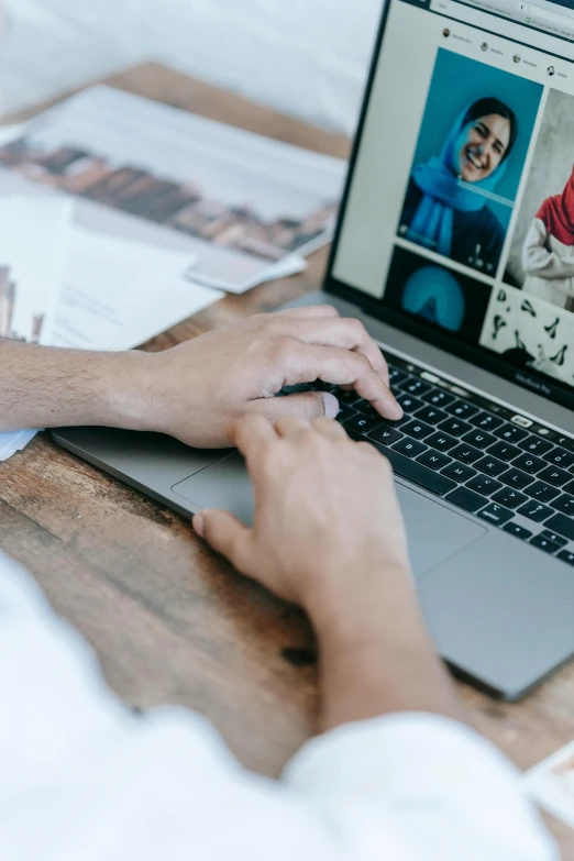 a person sitting at a desk using a laptop computer, a picture, trending on pexels, visual art, multiple stories, center of picture, headshot, flatlay