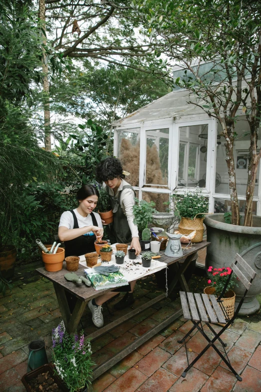 a couple of people that are sitting at a table, gardening, jinyoung shin, green house, splash image