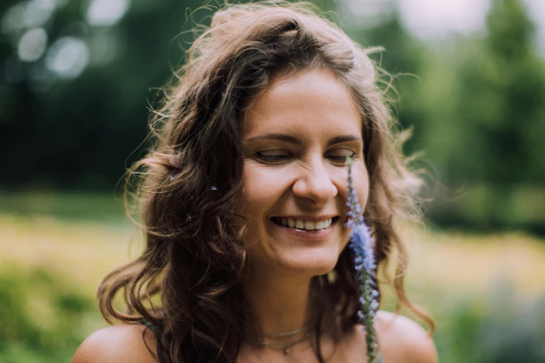 a close up of a woman with a flower in her hair, pexels contest winner, smiling softly, avatar image, half - length photo, nature photo