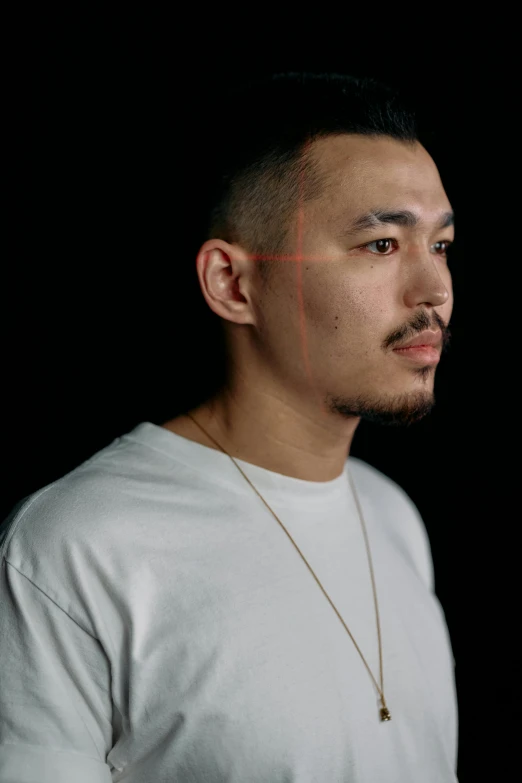 a man standing in front of a black background, inspired by Zhu Da, hyperrealism, tiny thin mustache, half asian, square jaw-line, promotional shot